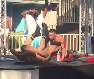 2 homo strippers smooch and eat each other at outdoor soiree