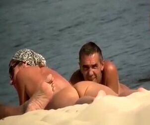 Spycam at naturist beach films bare guys and lady