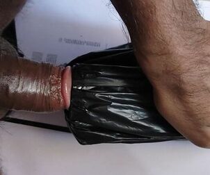 A studs plumb the dark-hued artificial pussy and milky paper