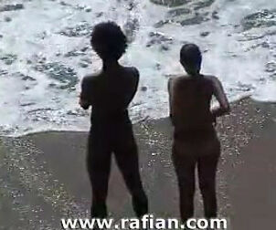 African and milky dolls sunbathing on naked beach