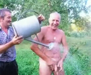 Mature father takes douche naked outdoor