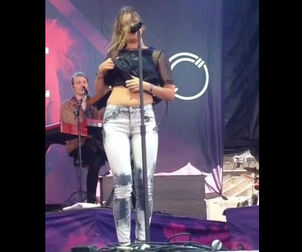 Swedish singer Tove Lo demonstrating her bosoms at concert