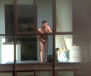Bare dude on the balcony in spy hidden cam movie