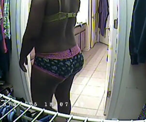 Round dark-hued mommy caught on spy webcam in store locker
