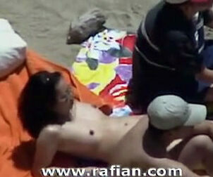 Oral fucky-fucky on naked beach from hidden cam camera