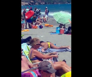 Spotted a gal milking on a public beach
