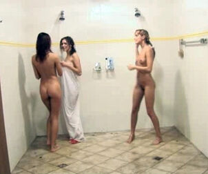 Nude nubile dolls lather each other in the douche after a